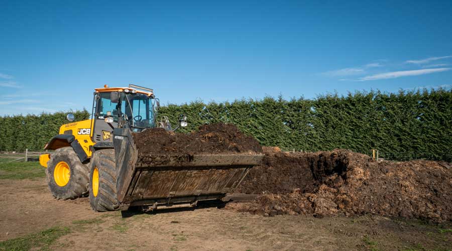 <p>Chicken farm compost ready to be spread to improve soil structure</p>