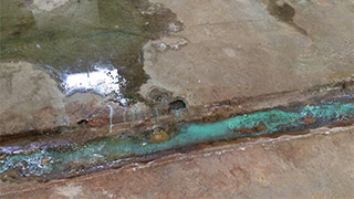 A chrome platers factory where hazardous substances have contaminated the building, floorslab, and penetrated into the soil below.