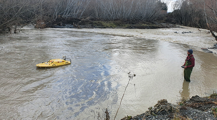 The yellow boat uses a type of sonar technology to measure the river flow
