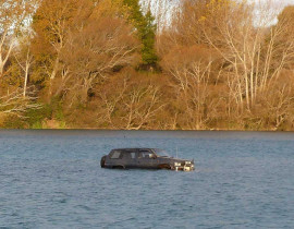 Another car swept away by the river