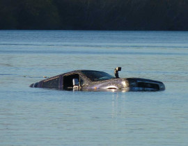 Car swept into the river