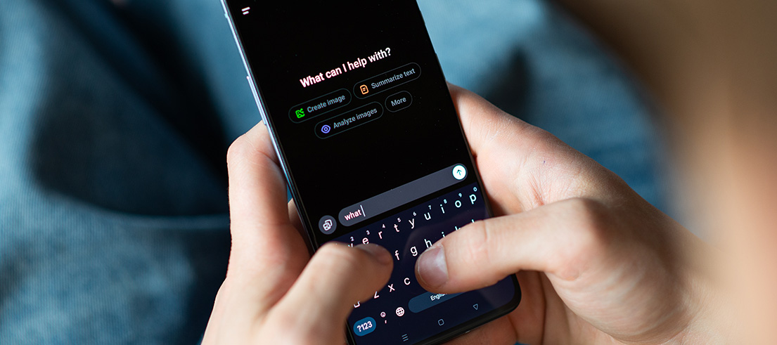 Person typing into an AI agent on a mobile phone